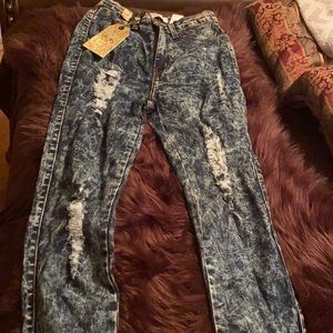 Dark denim distressed jeans. High waisted size 7